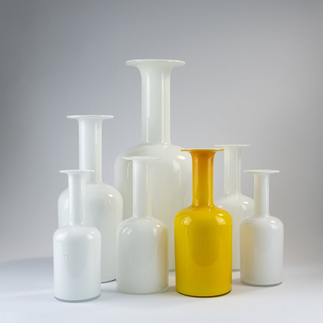 Otto Brauer, Seven vases, 1962: H. 25 - 51 cm. Made by Holmegaard Glasvaerk, Copenhagen. Glass, clear, white and mustard yellow. Marked: manufacturer's label. Literature: Exh. cat. Made in Denmark, Leipzig 2018, p. 179.