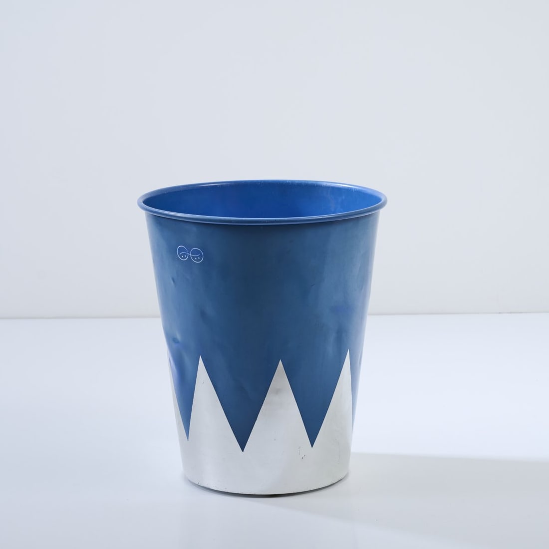 Philippe Starck, 'Colucci' stool / waste basket, 1986: H. 45 cm, Ø 40 cm. Made by XO, Brie-Compte-Robert. Sheet metal, partly painted silver-gray and blue. Literature: Philippi, STARCK, Cologne 2000, p. 182.