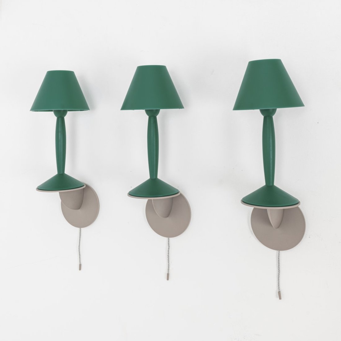 Philippe Starck, Three 'Miss Sissi' wall lights, 1990: H. 41 cm. Made by Flos, Brescia. Plastic, dark green and gray, gray cord. Literature: Cf. Philippi (ed.), STARCK, Cologne 2000, p. 236.