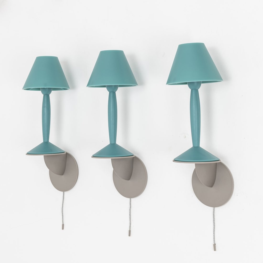 Philippe Starck, Six 'Miss Sissi' wall lights, 1990: H. 41 cm. Made by Flos, Brescia. Plastic, turquoise and gray, gray cord. Literature: Cf. Philippi (ed.), STARCK, Cologne 2000, p. 236.
