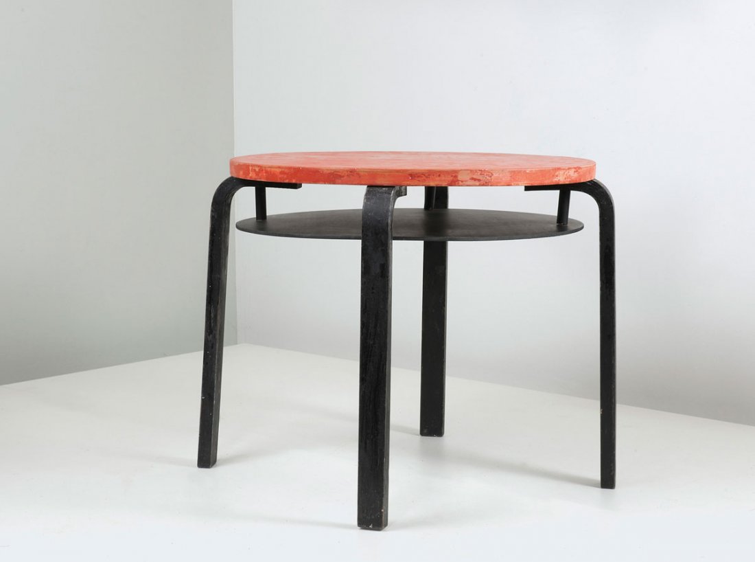 'T 70' table: Alvar Aalto. 'T 70' table, designed in 1932/33. H. 56 cm; D. 63 cm. Made by Huonekalu-ja Rakennustyoetehdas Oy, Turku. Birchwood and birch plywood, painted red and black.