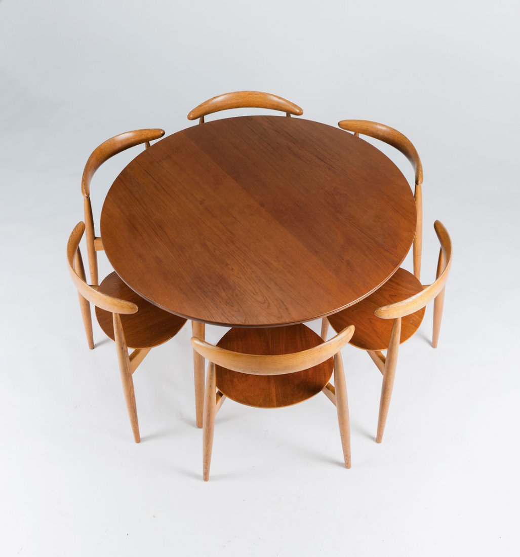 'FH 4602' dining chair and six 'FH 4103' chairs: Hans J. Wegner. 'FH 4602' dining chair and six 'FH 4103' chairs, designed in 1952. Table: H. 71 cm; D. 120 cm; chairs: H. 73 x 53 x 48 cm. Made by Fritz Hansen, Alleroed. Oak, plywood with teak veneer