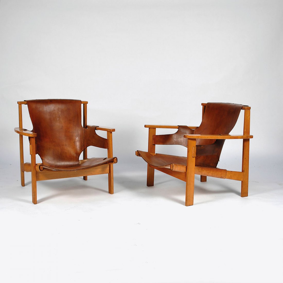 Carl-Axel Acking. Pair of 'Trienna' armchairs: Carl-Axel Acking. Pair of 'Trienna' armchairs, designed in 1957. H. 67 x 68.5 x 76 cm. Made by Nk:s verkstaeder, Nykoeping. Oak, leather.
