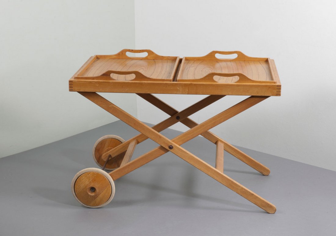 Tapio Wirkkala; Aulis Leinonen. Serving trolley: Tapio Wirkkala; Aulis Leinonen. Serving trolley, designed c1958. H. 63 x 90 x 55 cm. Made by Asko Oy, Helsinki. Birchwood and birch veneer, two trays with veneered bases, elmwood- birch- and teak veen