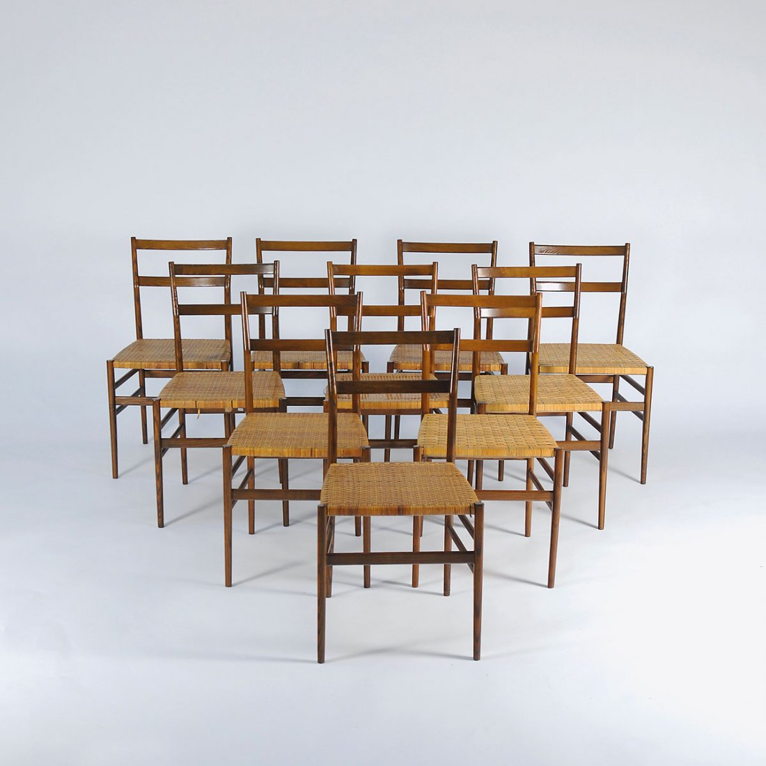 Gio Ponti. Ten 'Superleggera' chairs: Gio Ponti. Ten 'Superleggera' chairs, designed in 1957. H. 83 x 42.5 x 46 cm. Made by Cassina, Milan. Nutwood, wickerwork.