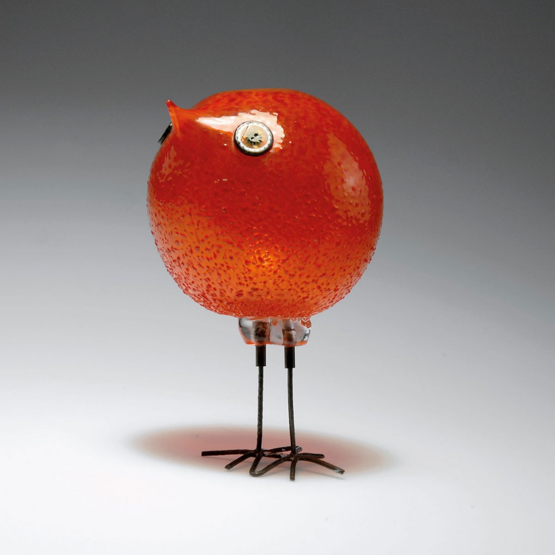 Alessandro Pianon. 'Pulcino' bird: Alessandro Pianon. 'Pulcino' bird, designed in 1962. H. 21.9 cm. Made by Vetreria Vistosi. Glass, clear and orange red with fused crushed glass, round murrhines as eyes, legs of hammered copper wire.