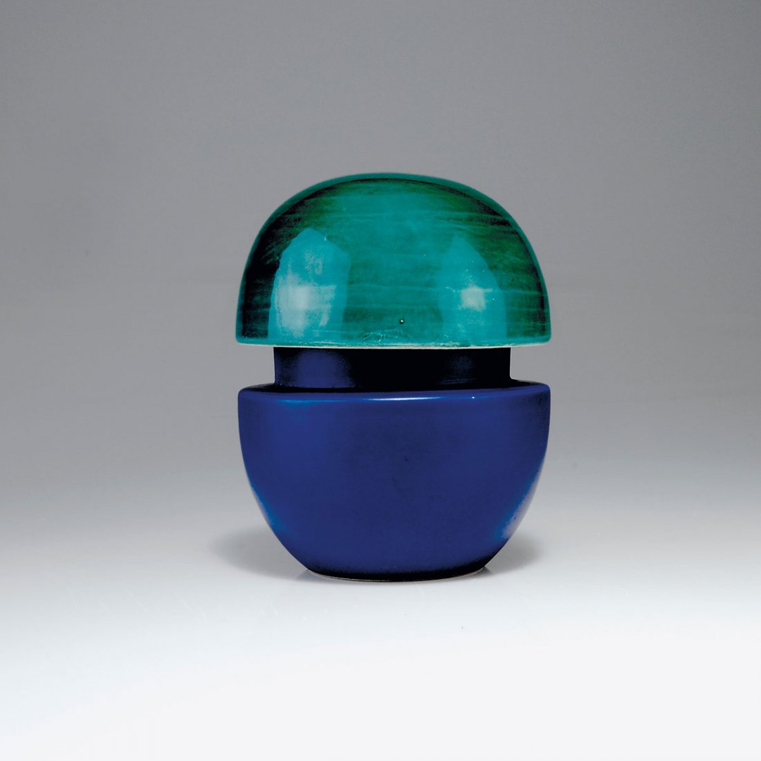 Ettore Sottsass. Container: Ettore Sottsass. Container, designed in 1962. H. 16.5 cm; D. 13.4 cm. Made by Il Sestante, Milan. Earthenware, glazed blue resp. green. Marked: SOTTSASS, 499, IL SESTANTE, further inscriptions.