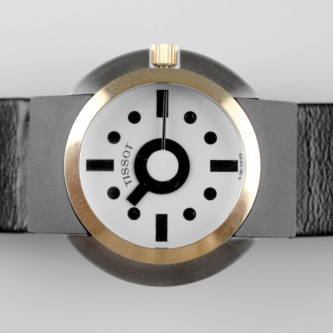 Ettore Sottsass. Watch: Ettore Sottsass. Watch, designed in 1980. L. 21.5 cm. Made by Tissot S. A., Le Locle, Switzerland, in 1988. Stainless steel, 18 ct gold, sapphire chrystal, black leather. Marked: TISSOT, S 150 SWISS,