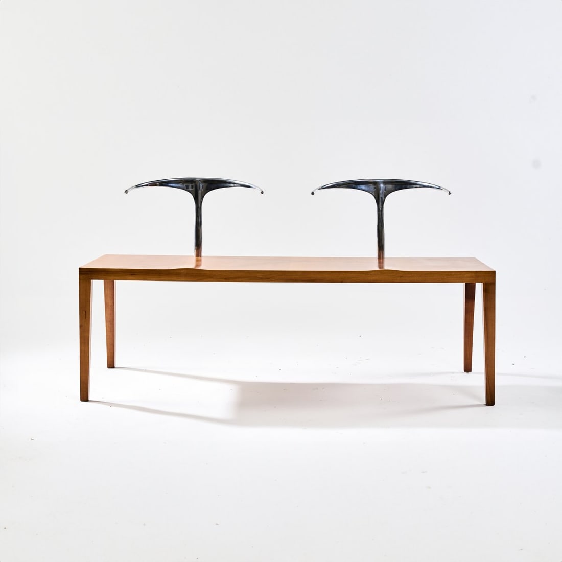 Philippe Starck , 'Royalton' bench, 1991: H. 71 x 137 x 51 cm. Made by Aleph Driade, Milan. Cherry wood veneer, pear wood, backrests made of cast aluminum. Marked: plaque ALEPH by STARCK. Literature: Philippi (ed.), STARCK, Cologne 2000, p.