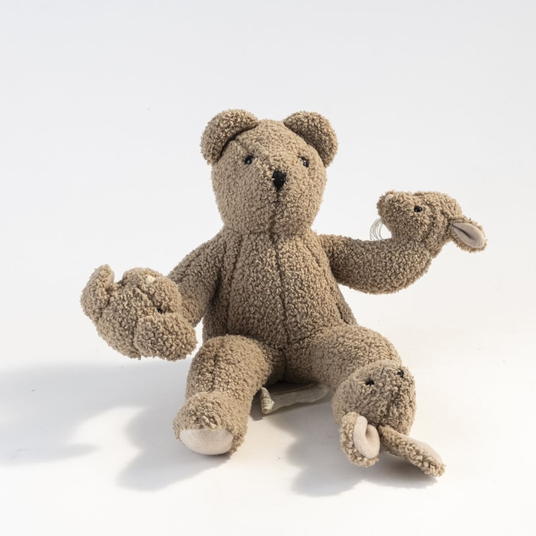 Philippe Starck, 'TeddyBearBand' toy, 1998: L. 35 cm. Made by Moulin Roty, Nort-sur-Erdre. Textile fabric, beige, Polyester. Marked: manufacturer's patch.