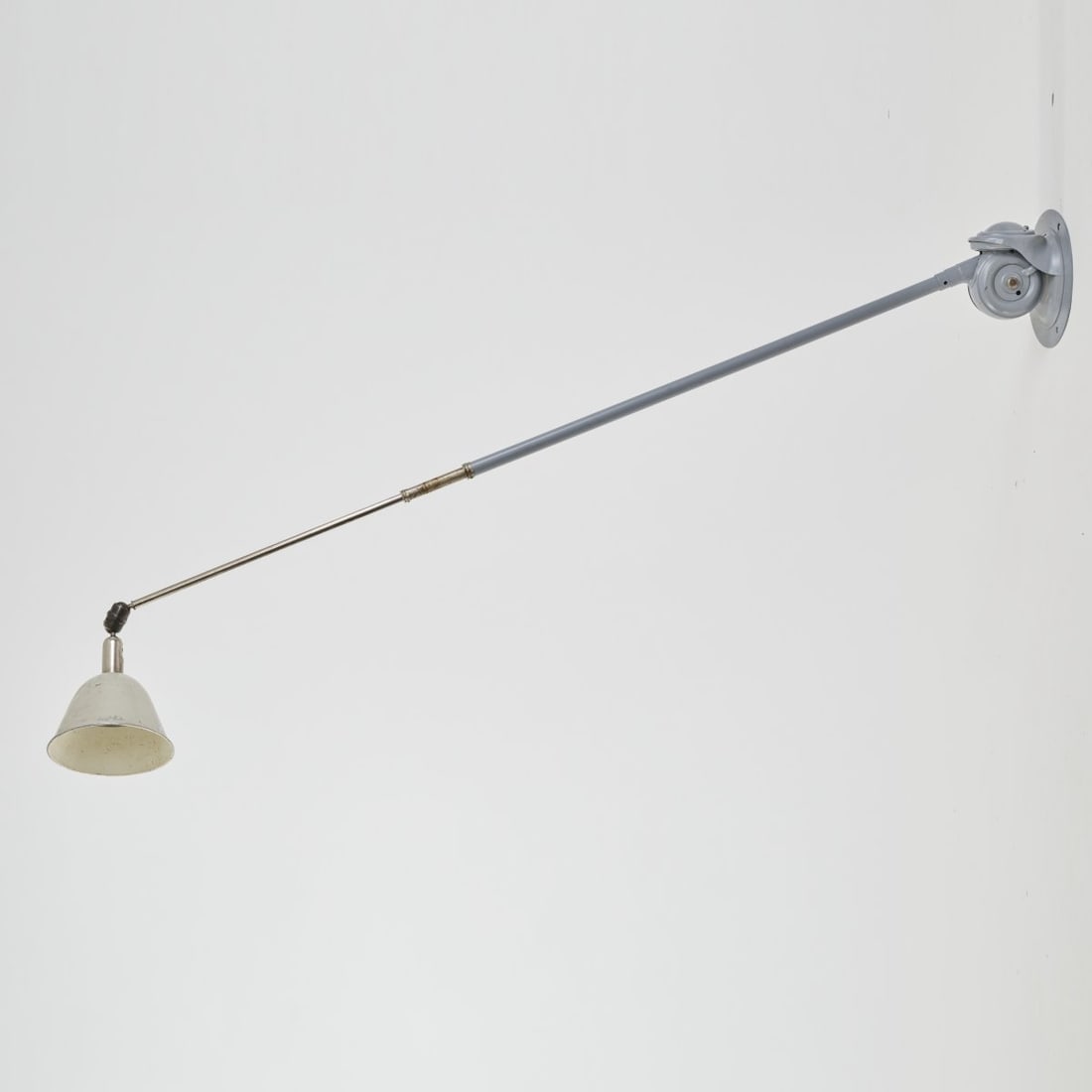 Johan Petter Johansson, 'Triplex' wall light, 1919: L. 150-315 cm. Made by Triplex, Sweden. Sheet metal, painted gray, tubular metal, nickel-plated, aluminum sheet. Marked: MADE IN SWEDEN, TRIPLEX - PENDULUM PATENT (embossed).