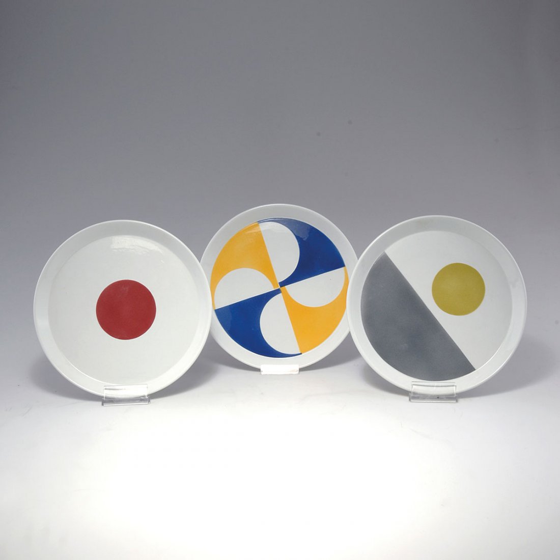 Seven plates, c1967: Gio Ponti. Seven dininig plates, c1967. D. 25.8 cm. Made by Ceramica Franco Pozzi, Gallarate. Earthenware, polychromatic glaze on white. Marked: Ponti, maker's mark, CS/10.