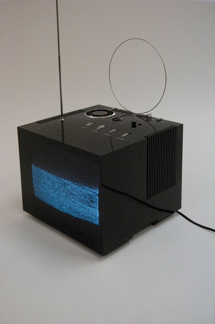 'Black st 201' TV-set with cover, 1969: Marco Zanuso; Richard Sapper. Portable 'Black st201' TV-set, 1969. H. 25.6 x 31.1 x 29.5 cm. Made by Brionvega, Milan. Black acrylic, metal, white plastic. Marked: black st 201, Brionvega, modello dep