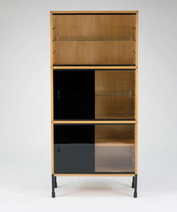 Cupboard / credenza, c1955: Pierre Guariche. Shelf/credenza, c1955. H. 166 x 74 x 28 cm. Made by Atelier de Recherche Plastique (ARP), Paris; Minivielle, Paris. Wooden construction with birch veneer, rectangular steel, painted b