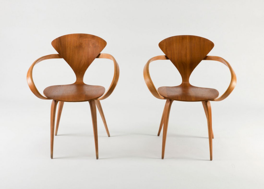Pair of 'Cherner' chairs, 1957: Norman Cherner. Pair of 'Cherner' chairs, 1957. H. 79.5 x 64 x 55 cm. Made by Plycraft, Lawrence. Plywood, American nut veneer. Marked: Maker's label.