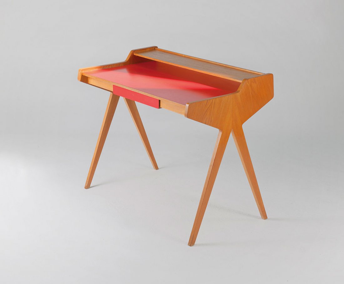 Writing desk, c1955: Helmut Magg. Writing desk, c1955. H. 83.5 x 100 x 60.5 cm. Made by Deutsche Werkstaetten, Munich (attributed). Blockboard with elm veneer, red formica.
