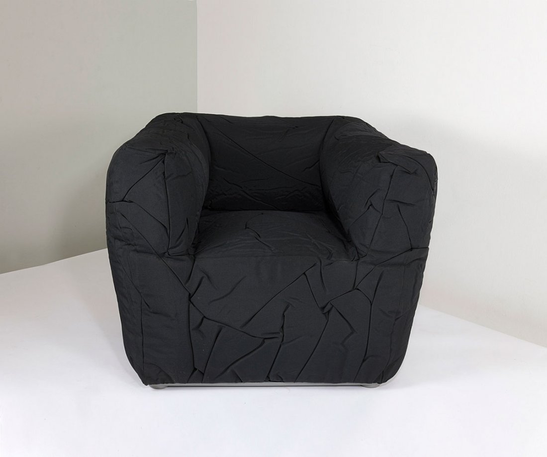 'Sponge' chair, 2004: Peter Traag. 'Sponge' chair, 2004. H. 75 x 103 x 86 cm. Made by Edra, Milan. Black fabric upholstery, grey plastic frame. Marked: Maker's label and embossing: Edra Sponge Peter Traag.