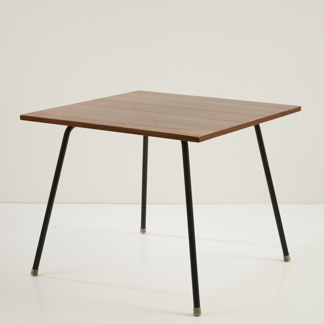 Egon Eiermann, Table, c. 1952: H. 62 x 75.5 x 75.5 cm. Made by Wilde & Spieth, Esslingen. Metal tube, painted black, blockboard, teak veneer, rubber feet. Literature: Cf. exh. cat. Egon Eiermann Die Möbel, Karlsruhe 1999,