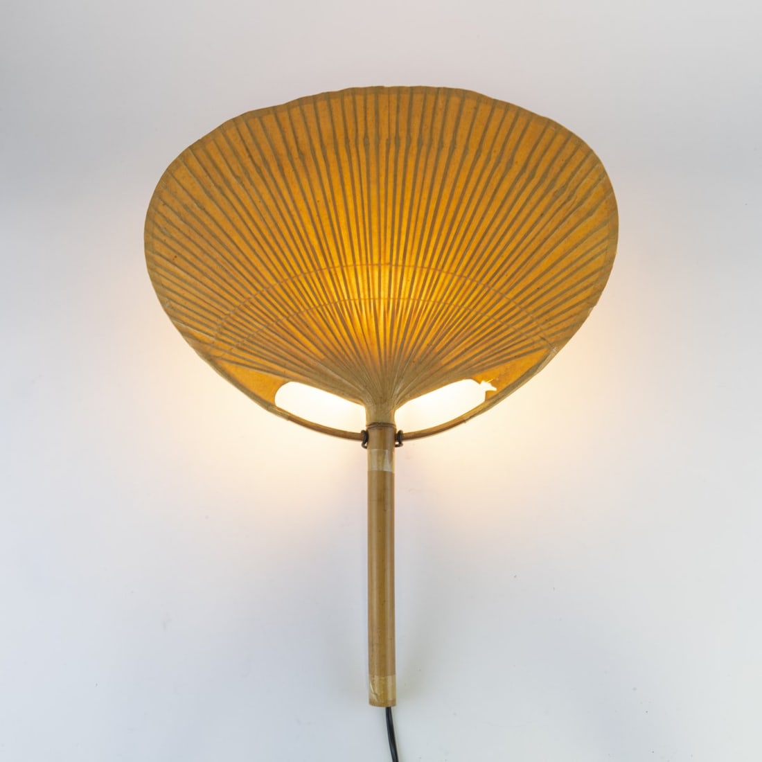 Ingo Maurer, 'Uchiwa IV' wall light, 1973: H. 59.5 x 46.5 cm. Made by Design M Ingo Maurer, Munich. Bamboo cane, rice paper, metal staffs, painted black. Marked: manufacturer's label. Literature: Bauer (ed.), Ingo Maurer. Making Light, Munich