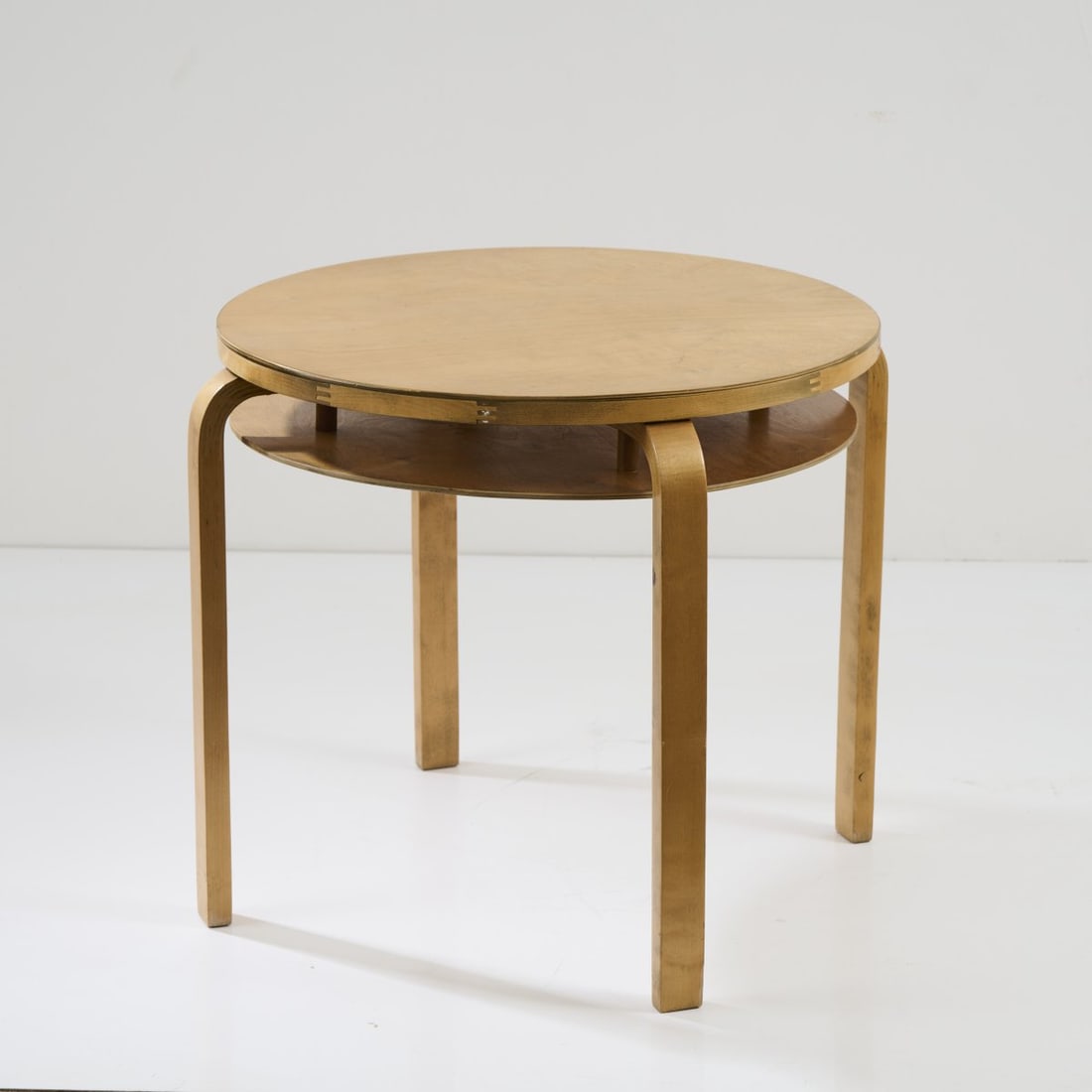 Alvar Aalto, '70' table, 1933: H. 55.5 cm, Ø 62.5 cm. Made by Huonekalu-ja Rakennustyötehdas Oy, Turku for Artek, Helsinki (attr.). Birch plywood. Literature: Kellein, Alvar & Aino Aalto. design, Ostfildern 2005, p