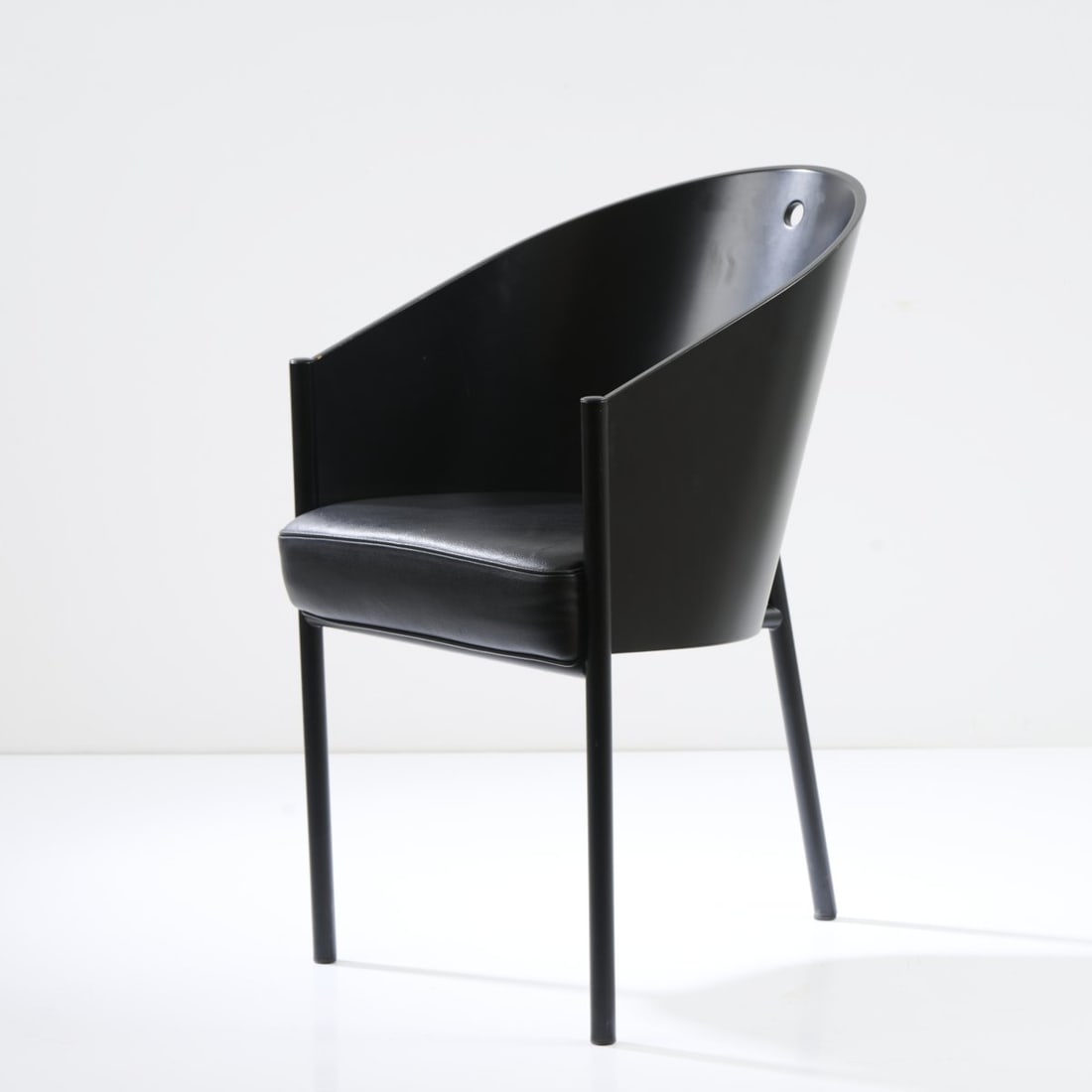 Philippe Starck, Armchair 'Costes', 1982: H. 81 x 48 x 61.5 cm. Made by Driade Aleph, Caorso. Plywood, painted black, black imitation leather, tubular metal, painted black. Marked: two manufacturer's stickers, embossed: ALEPH STARCK.