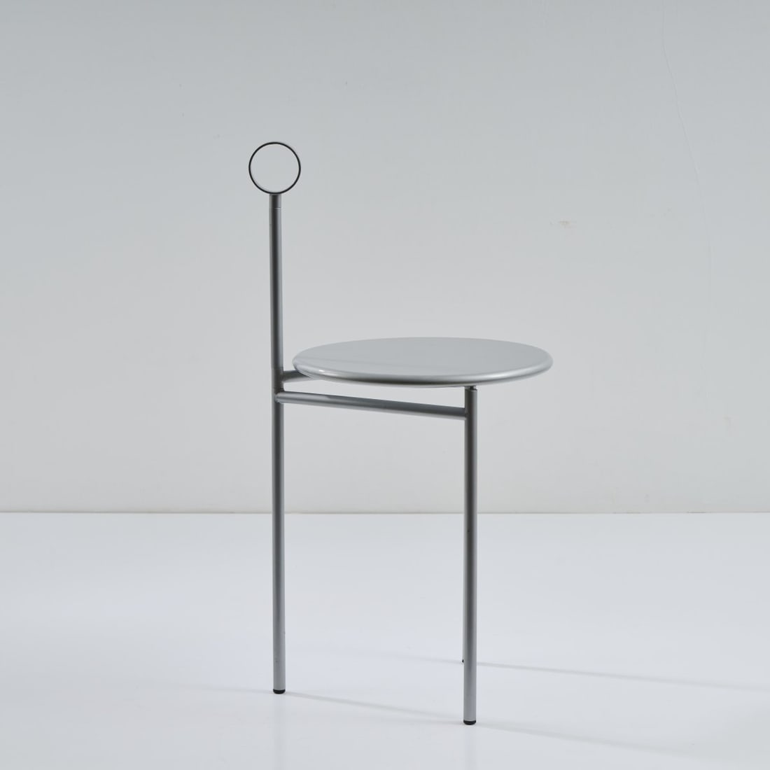 Philippe Starck, Chair / side table 'Mickville', 1985: H. 82 x 42 x 38 cm. Made by Driade Aleph, Milan. Tubular metal, sheet metal, painted gray. Marked: manufacturer's paper label.