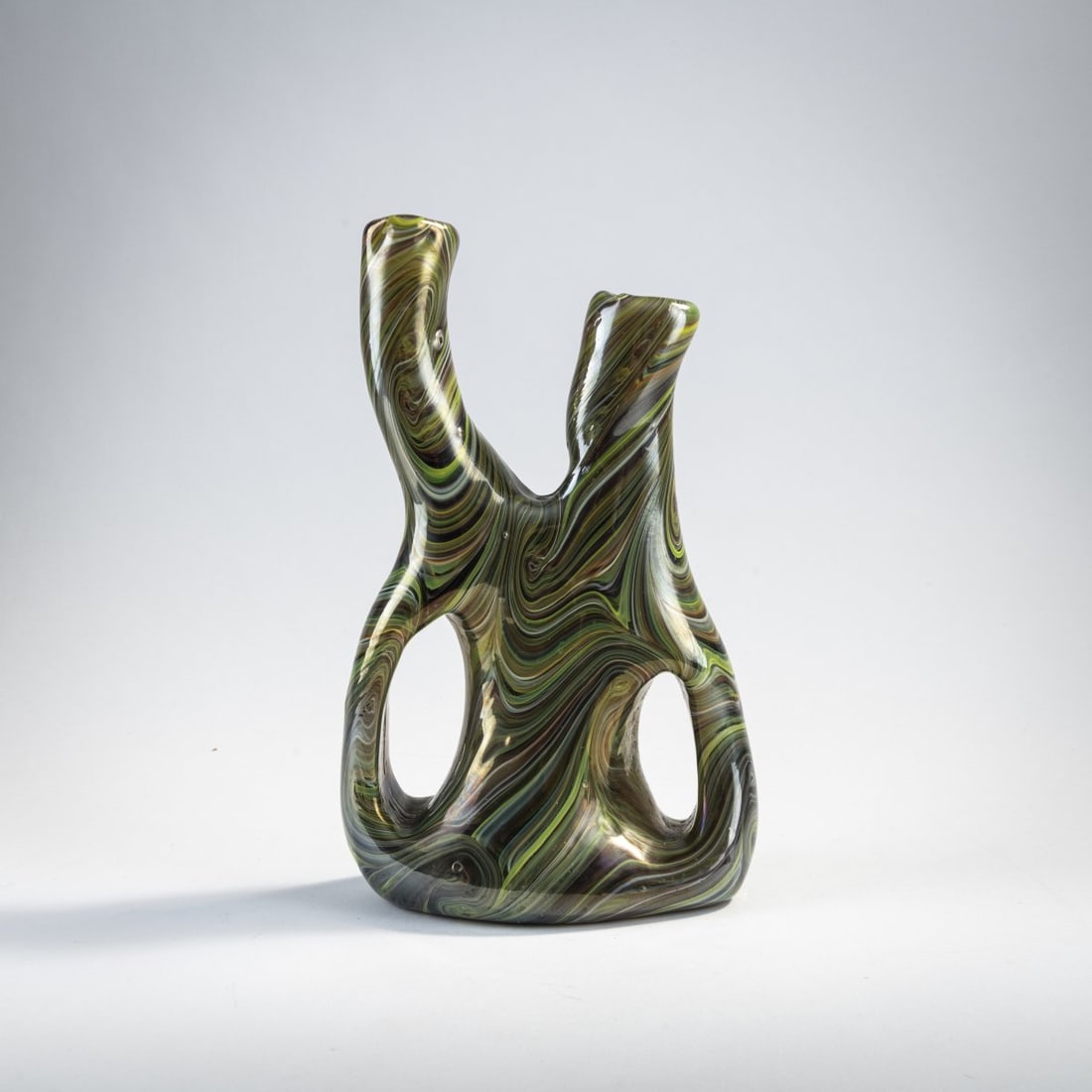 Ermanno Nason, 'Calcedonio' vase, c. 1960: H. 24.5 cm. Execution: Gino Cenedese. Colorless glass with marbled fusions in shades of green and brown, iridescent. Literature: Cf. Franco Deboni, Murano '900, Milan 1996, no. 79.
