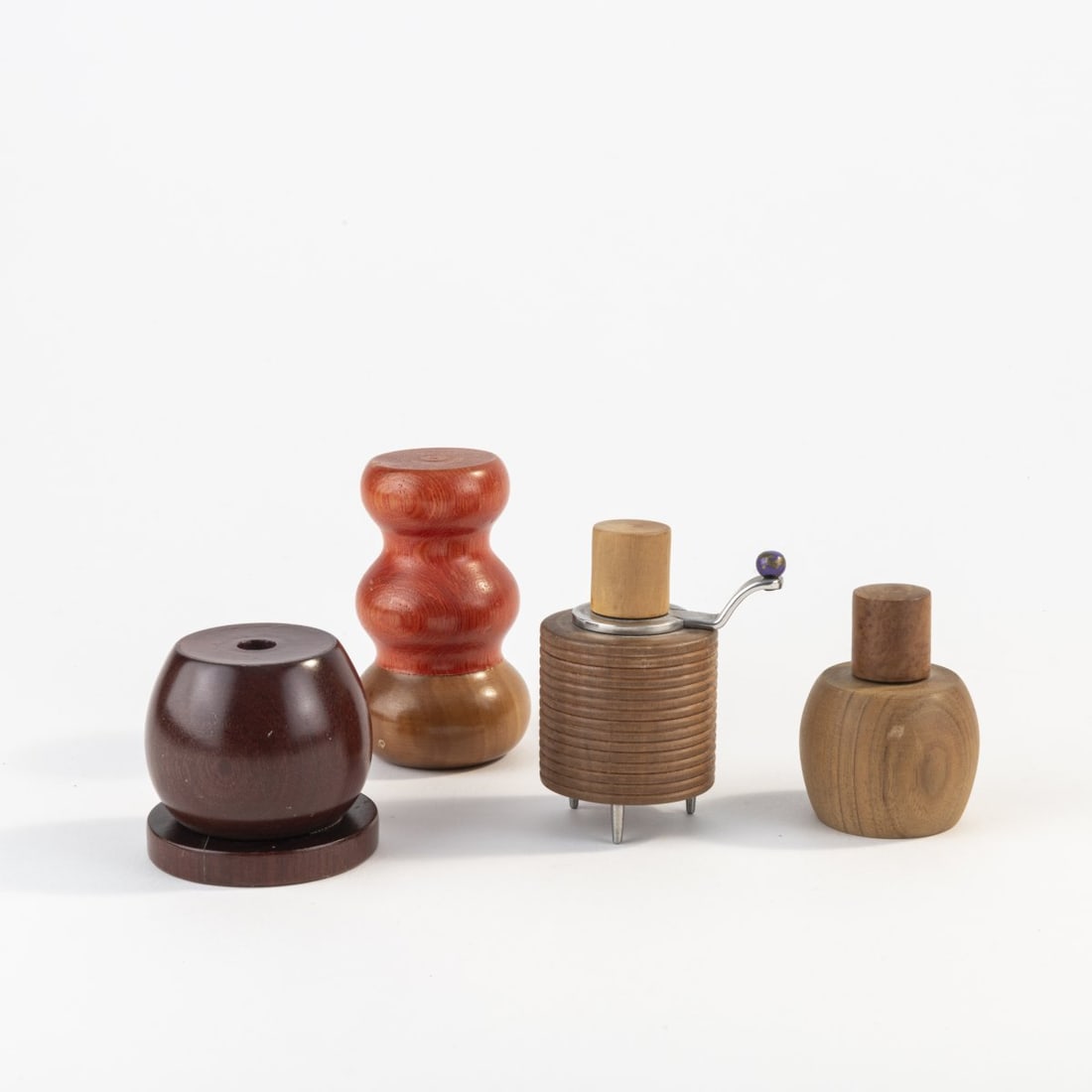 Adalberto Pironi; Marco Zanini et al., Four prototypes for pepper mills, c. 1989: Prototypes for 'MO 310' and 'MPO 720', two unrealized prototypes. H. 6 - 9 cm. Made by Alessi Twergi, Crusinallo. Wood, partially painted, metal.
