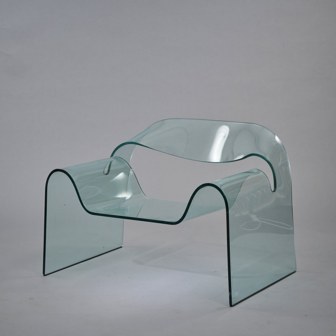 Cini Boeri; Tomu Katayanagi, 'Ghost' armchair, 1987: H. 62 x 90 x 78 cm. Made by Fiam, Scorze. Bluish glass. Marked: manufacturer's mark. Literature: Fiell (ed.), 1000 Chairs, Cologne 1997, p. 592.