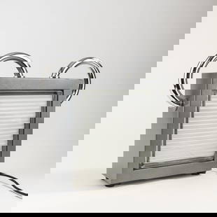 Matteo Thun , Table light 'Topolino' from the 'Loftlight' series, 1989: H. 34 x 39 x 10.5 cm. Made by Bieffeplast, Padua. Chrome-plated tubular steel, sheet steel, painted gray, safety glass, clear and white. Marked: manufacturer's label. Literature: Bassi, La Luce Itali