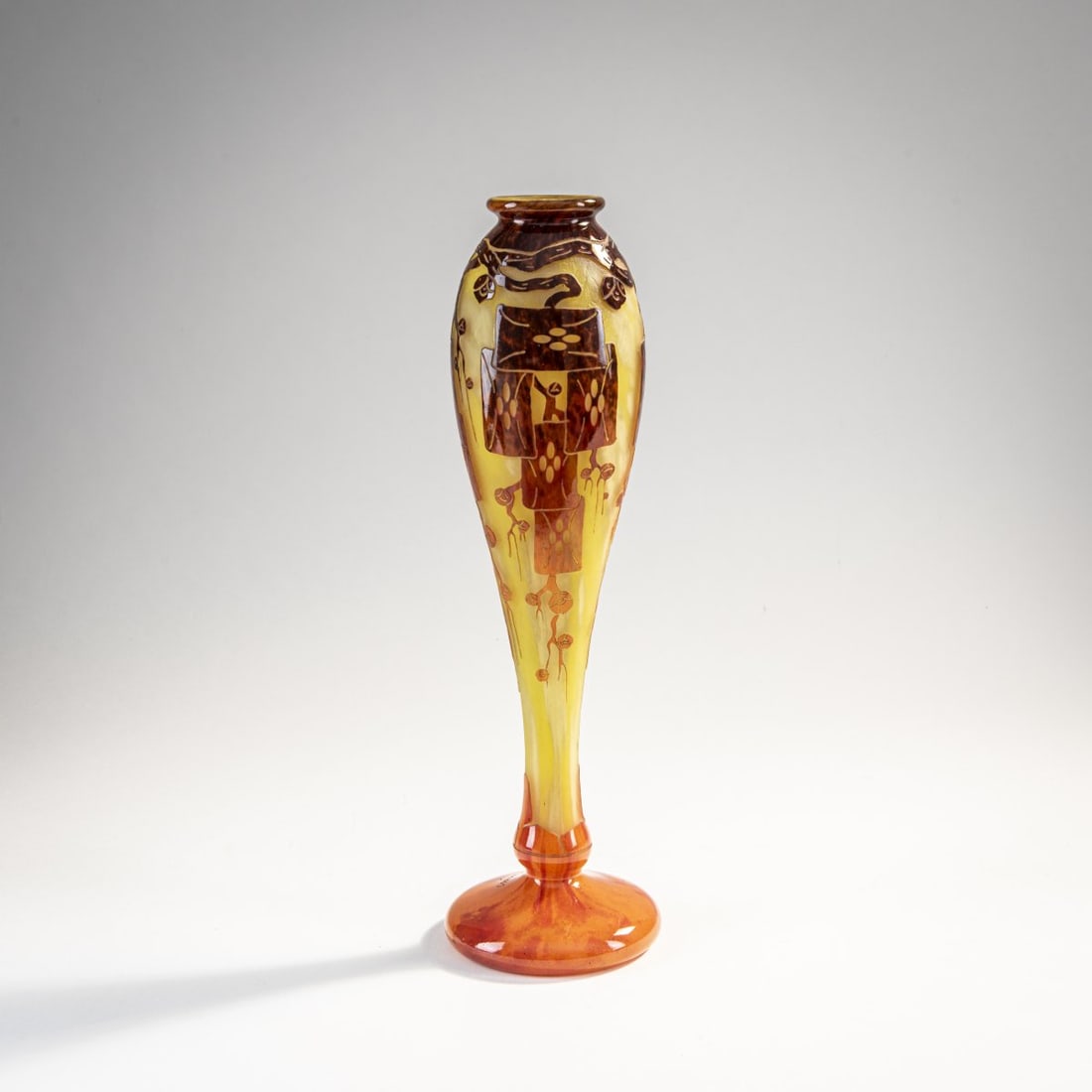 Schneider, Epinay-sur-Seine, Vase 'Frênes', 1924-27: H. 35.2 cm. Cased glass, colorless, yellow powder inclusions, orange and violet enamel fusions. Etched decoration with ash branches. Signed: Charder (raised), Le Verre Français (needle etching)