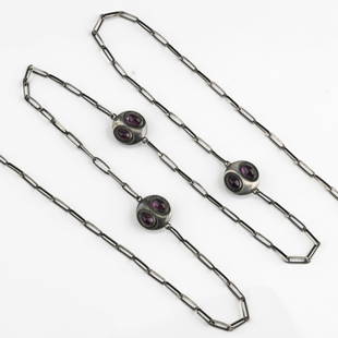 Theodor Fahrner, Necklace, c. 1918: Silver 935, amethyst cabochons. 37.13 grams. L. 1550 mm (open). Marked: TF, 935, DEPOS&Eacute; (stamped).