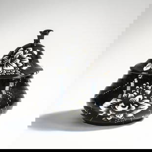 Dagobert Peche, Box and cover, c. 1912: H. 11 cm. Execution: Vereinigte Wiener und Gmundner Keramik. Earthenware, black and white glaze, stylized floral decor. Marked: Signets of the Wiener and Gmundner Ceramics, VI, 311 (embossed), /5 (bla