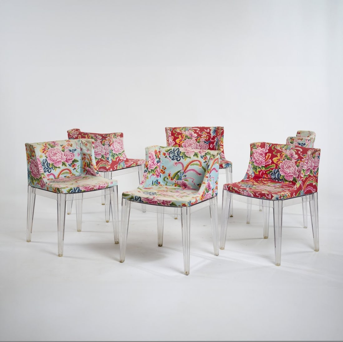 Philippe Starck, Six chairs 'Mademoiselle', 1990s: H. 74 x 54 x 51 cm. Made by Kartell, Noviglio. Acrylic, polychrome floral textile cover. Marked: manufacturer and designer's stamps.