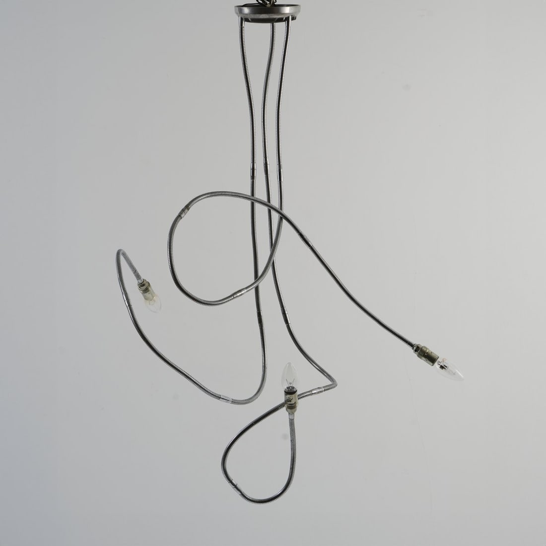 Stiletto; Frank Schreiner, Wall light 'Suzuki' and ceiling light 'Honda', 1987/89: Ceiling light: H. max. 170 cm; wall light H. 35 x 10 x 12 cm. Made by Stiletto Studios, Berlin. Goosenecks, alternator covers from Honda and Suzuki. Marked: "Honda" #28 16/10/87 Stiletto; 20