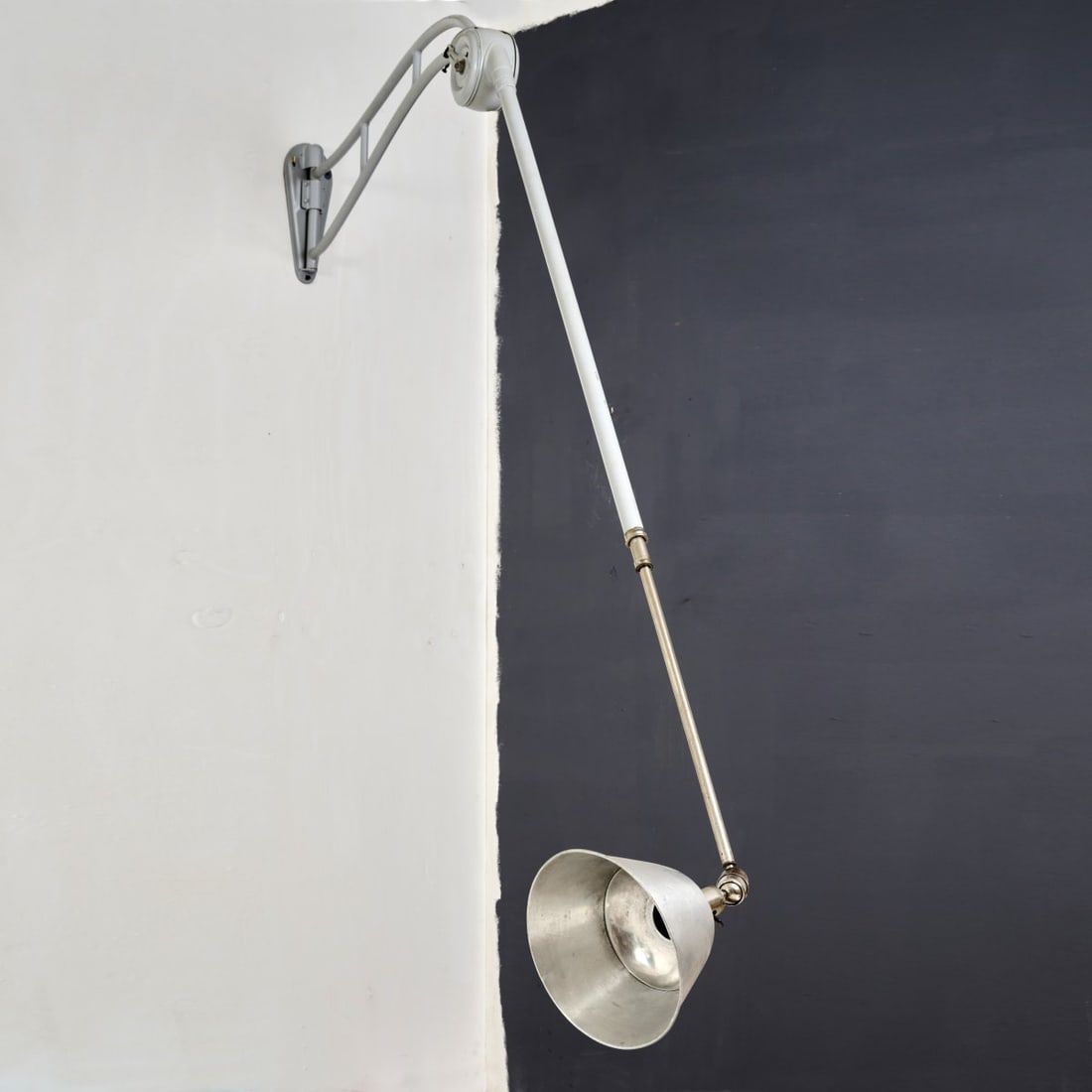Johan Petter Johansson, 'Triplex' wall light, 1919: L. 138-410 cm, Ø 22 cm. Made by Triplex, Sweden. Metal sheet, tubular metal, painted white, tubular metal, nickel-plated, aluminum sheet. Marked: MADE IN SWEDEN - TRIPLEX PENDULUM PATENT (embos