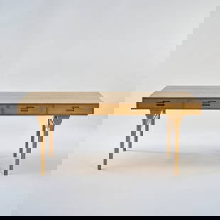 Nanna Ditzel, Desk '93', 1952: H. 71 x 175 x 75 cm. Made by Søren Willadsen Furniture, Vejen, Denmark. Wooden box construction, oak and oak veneer. Marked: manufacturer's sticker. Literature: Hansen/Petersen, Den Store Dans