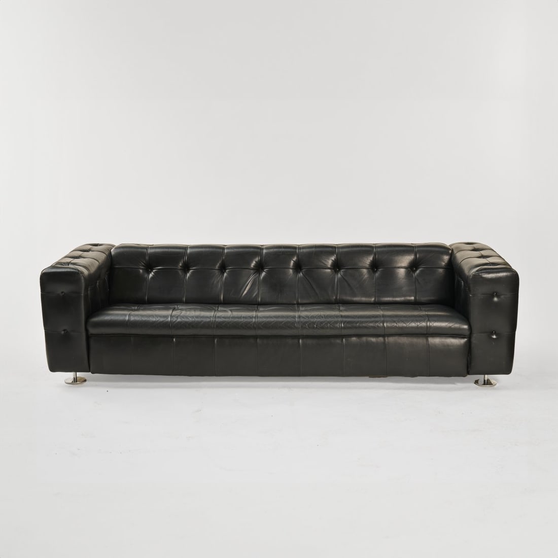 Robert Haussmann, 'James Bond' 3-seat sofa 'RH 306', circa 1962: H. 67 x 248 x 89 cm. Made by DeSede, Klingnau. Wooden frame construction, black leather, metal feet. Literature: This piece of furniture was used in the 6th James Bond film, 'On Her Majesty's Secret
