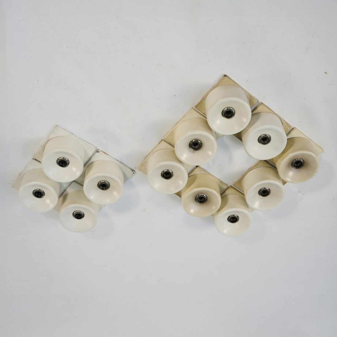 Cini Boeri, Twelve '268' ceiling lights, 1971: H. 13 x 20.5 x 20.5 cm. Made by Arteluce, Milan. Sheet metal, painted white. Literature: Cf. Gramigna, Repertorio 1950-1980, Milan 2001, p. 355.