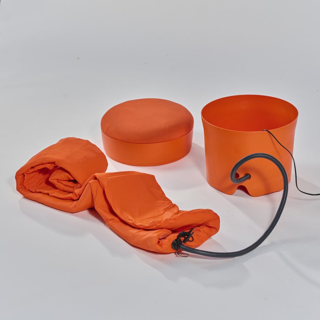 Denis Santachiara, 'Pisolo' stool with guest bed, 1997: Stool: H. 49 cm, Ø 42 cm; Guest bed: 176 x 70 cm. Made by Campeggi, Anzano del Parco. Orange plastic, textile cover and rubber mat. Marked: manufacturer's embossing.