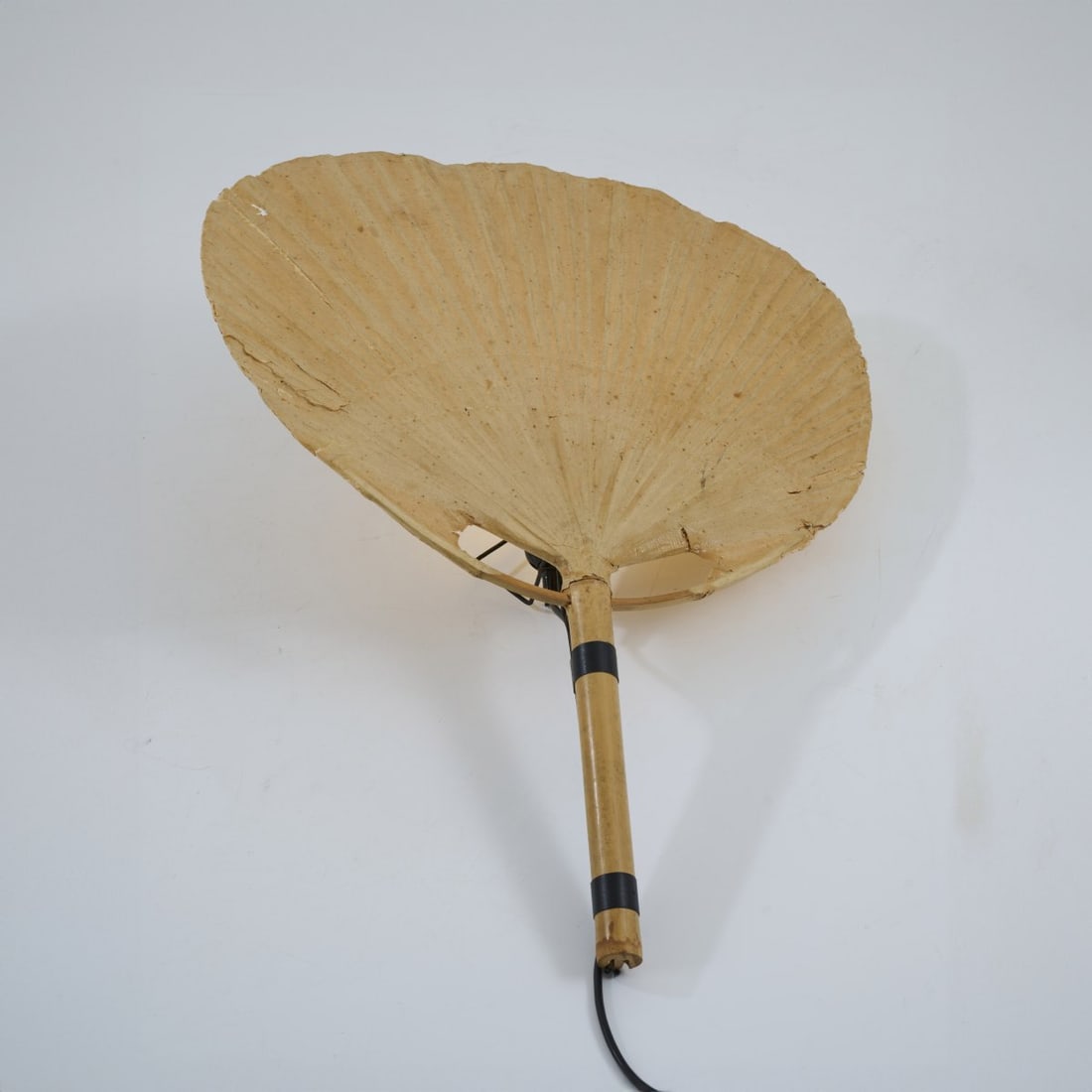 Ingo Maurer, 'Uchiwa III' wall light, 1973: H. 74 cm. Made by Design M, Ingo Maurer, Munich. Bamboo cane, rice paper.