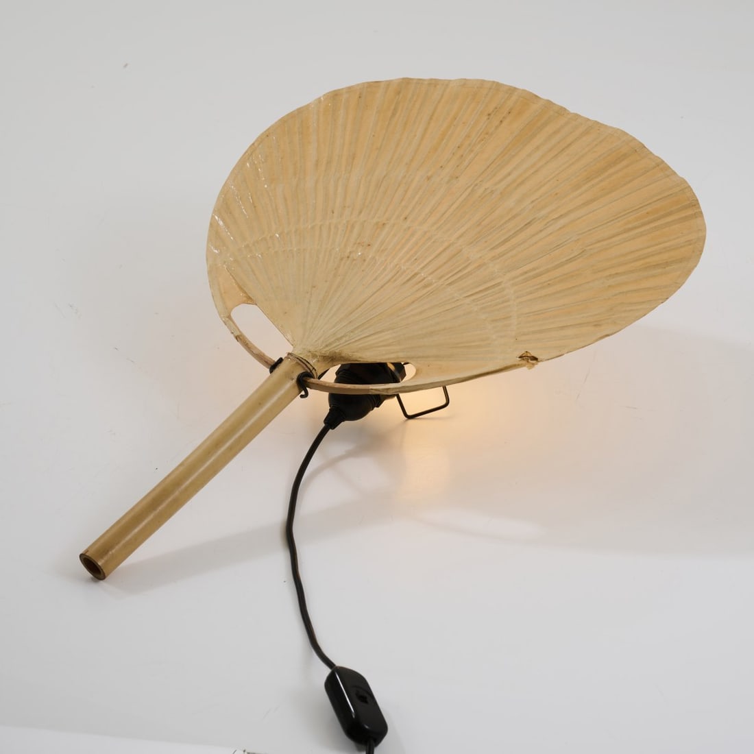 Ingo Maurer, 'Uchiwa IV' wall light, 1973: H. 59 x 45 cm. Made by Design M Ingo Maurer, Munich. Bamboo cane, rice paper, metal rods, painted black. Literature: Bauer (ed.), Ingo Maurer. Making Light, Munich 1992, p. 249; Company catalogue Des