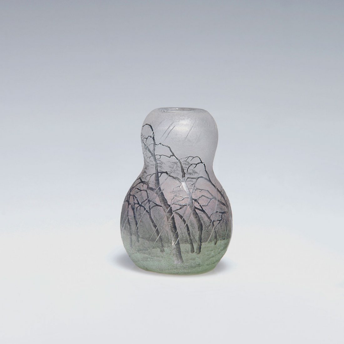Small 'Pluviose' vase, c1900: Daum Freres, Nancy. Small 'Pluviose' vase, c1900. H. 5 cm. Designed by Henri Berge. Cased glass, clear, in the lower part green, above pink powder inclusions. Etched pattern, Grisaille paint. Pattern