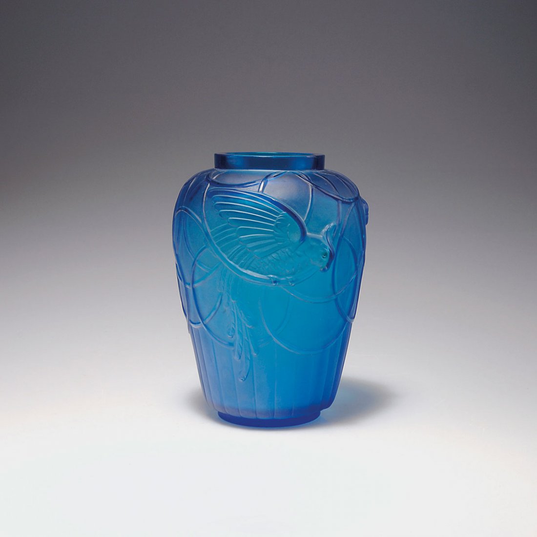 Vase with parrots, c1930: Marius-Ernest Sabino, Paris. Vase with parrots, c1930. H. 20.9 cm. Blue moulded glass. Marked: Sabino France.