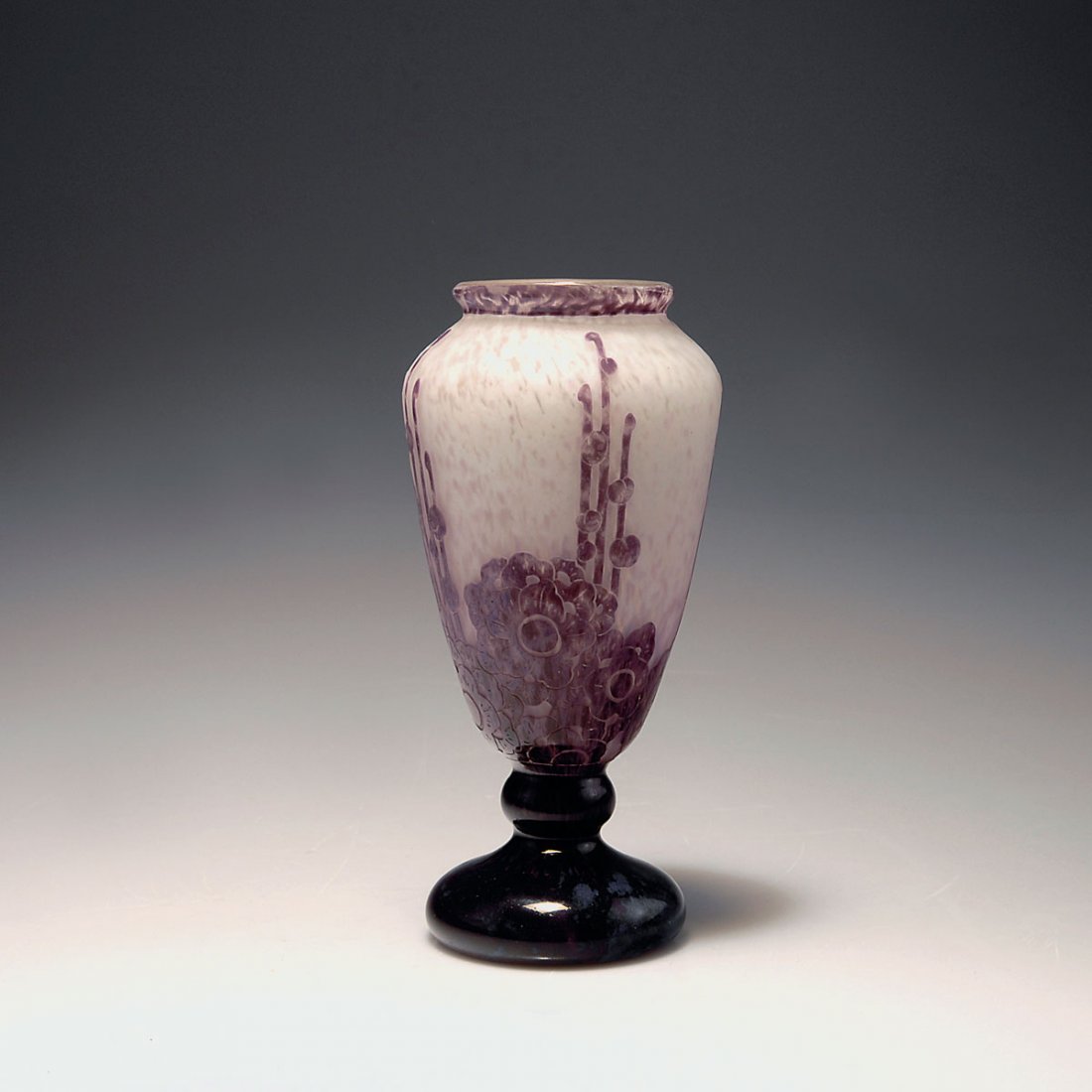 Roses tremieres' vase, 1927-28: Verreries Schneider, Epinay-sur-Seine. 'Roses tremieres' vase, 1927-28. H. 20 cm. Cased glass, clear, milky white powder inclusions, purple enamel fusions with blue dots. Multiply etched pattern with