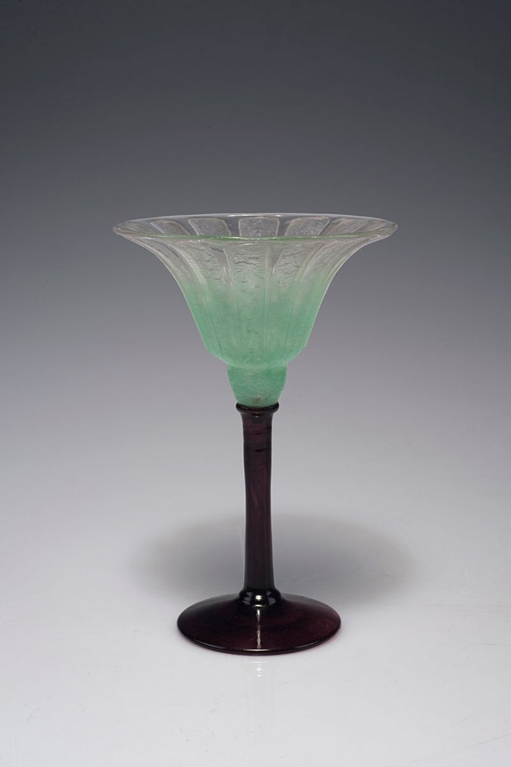 Coupe Bijou a cotes', 1927-29: Verreries Schneider, Epinay-sur-Seine. 'Coupe bijou a cotes', 1927-29. H. 17.6 cm; D. 11.5 cm. Cased glass, clear, light green powder inclusions, rough pattern. Foot purple. Signed: SCHNEIDER.