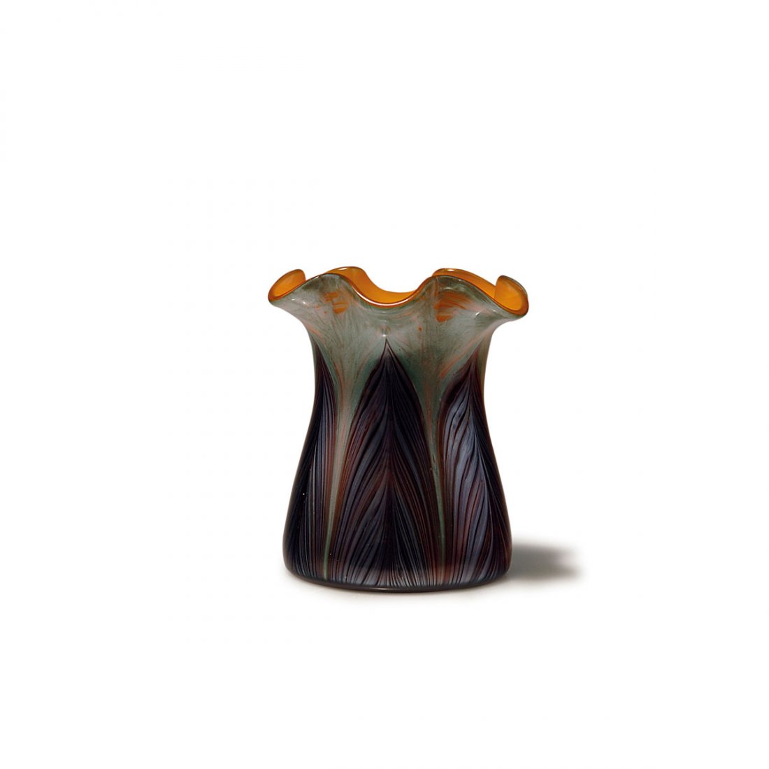 'Titania' vase, c1907: Loetz, Klostermuhle. 'Titania' vase, c1907. H. 12.8 cm. Cased glass, orange opal and clear, between layers silver threads, in the lower part combed red leaves, Titania Gre 5022.