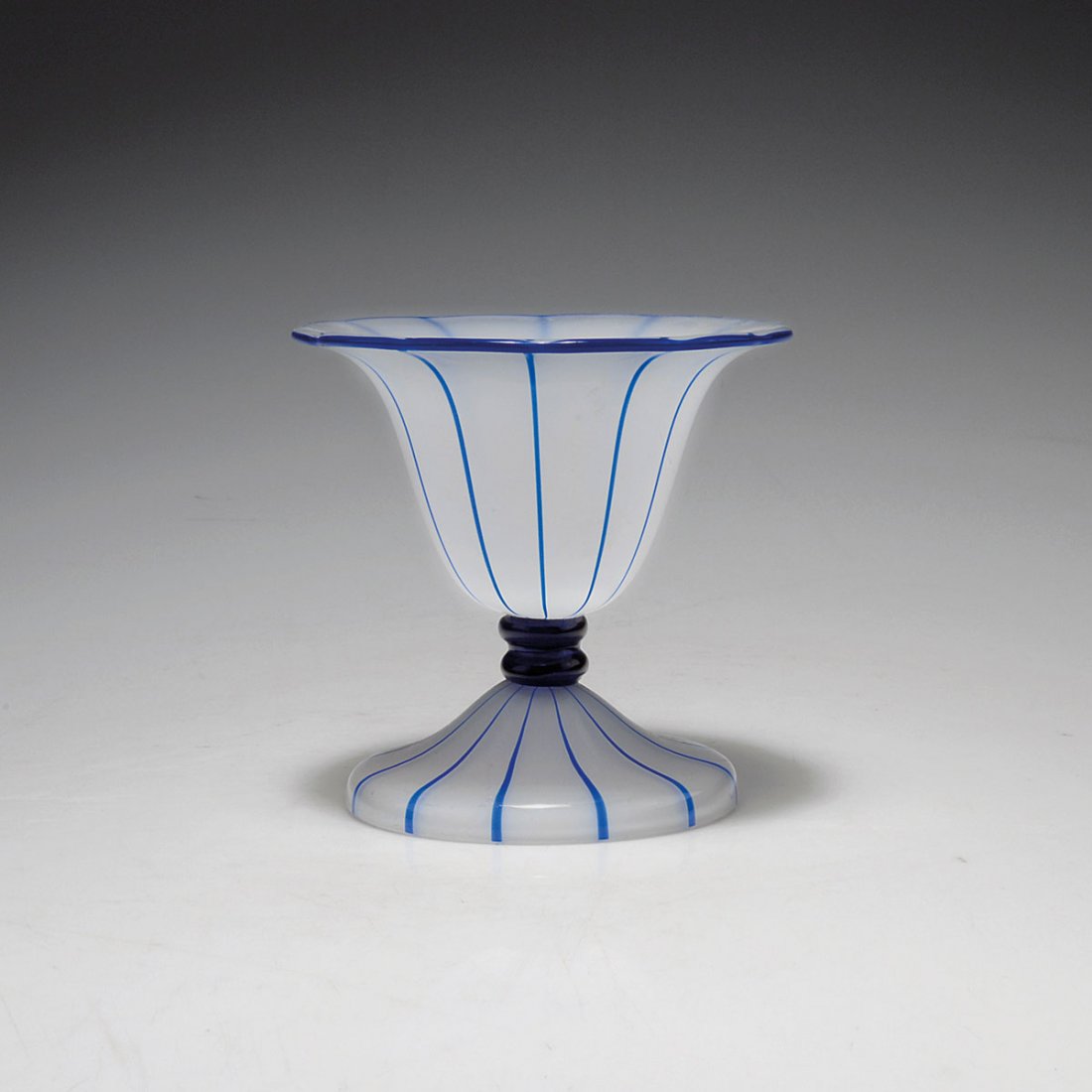 Vase, 1914: Loetz, Klostermuhle. Vase, 1914. H. 12.2 cm. Designed by Michael Powolny. Cased glass, clear and opal white, applied blue stripes, also on the rim.