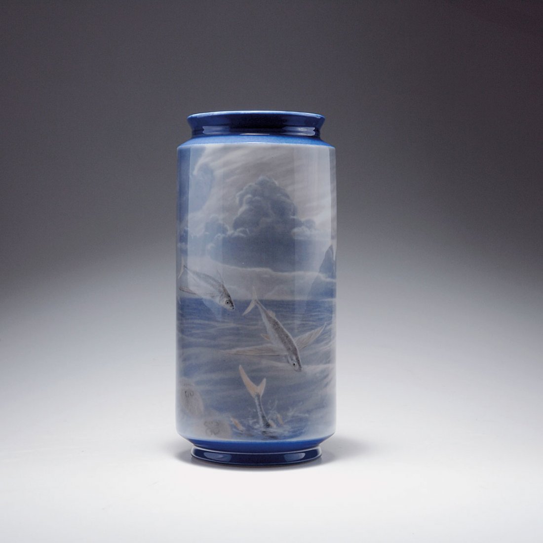Unicum vase with flying fish, 1890: Royal Copenhagen. Unicum vase with flying fish, 1890. H. 35 cm. Shape by Arnold Krog. Porcelain, white, glazed, underglaze in blue, grey and pink by Gerhard Heilmann. Three flying fish, jellyfish and
