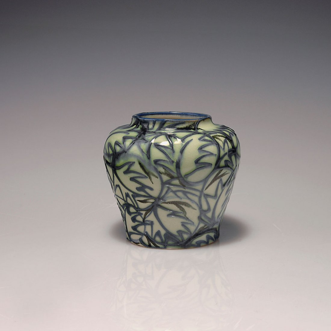 Vase Zweige und Blatter', 1921-25: Max Laeuger, Karlsruhe. 'Vase, Zweige und Blatter', 1921-25. H. 10.3 cm. Made by Majolikamanufaktur Karlsruhe. Majolica, glazed green on white, slip paint dark green and black, blue, craquelure. Marke